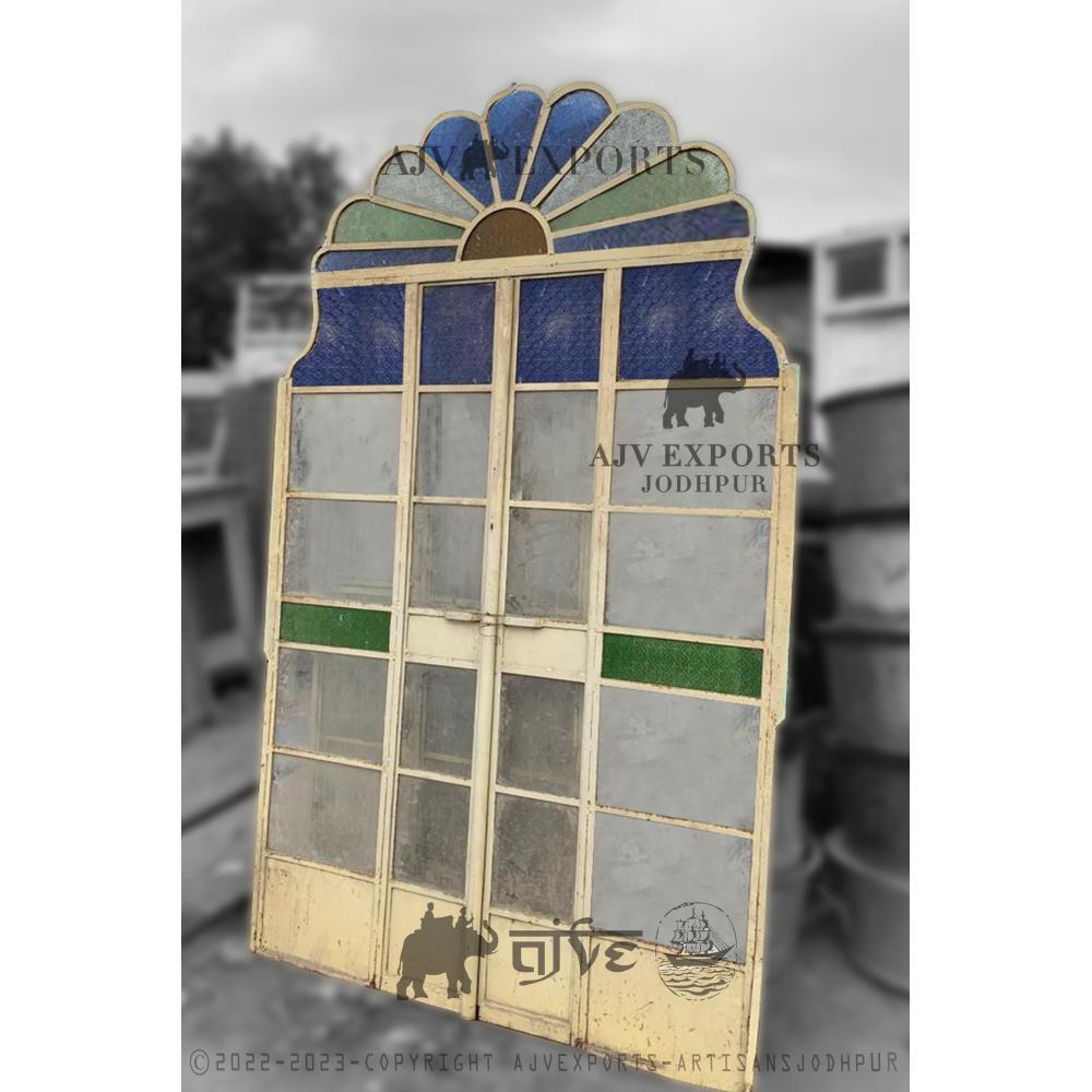 Vintage arched iron door frame with carvings