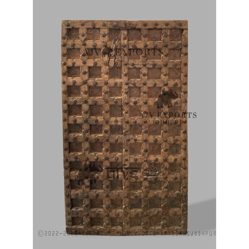 Rustic wooden door with iron grid pattern