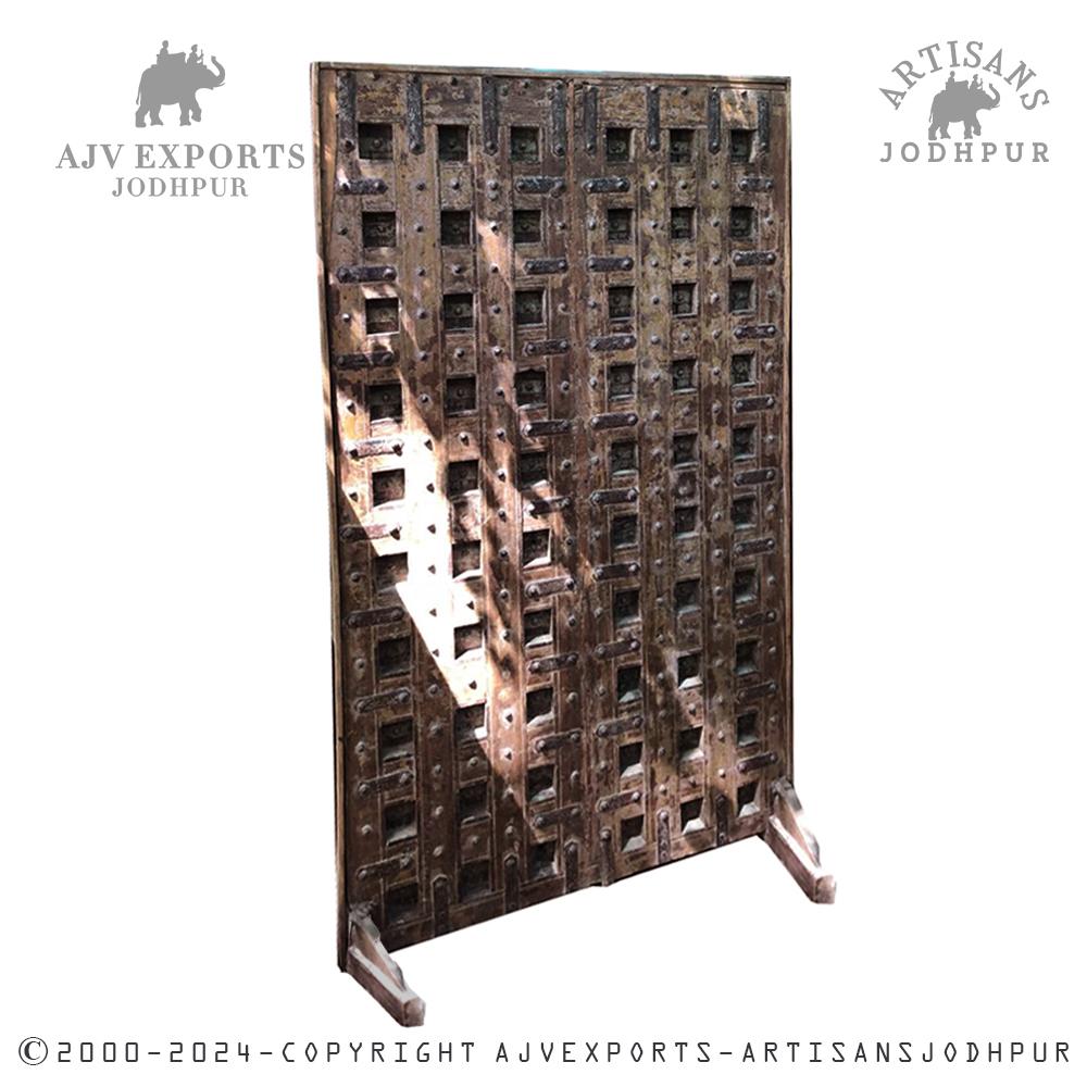 Wooden door with heavy latticework and distressed finish