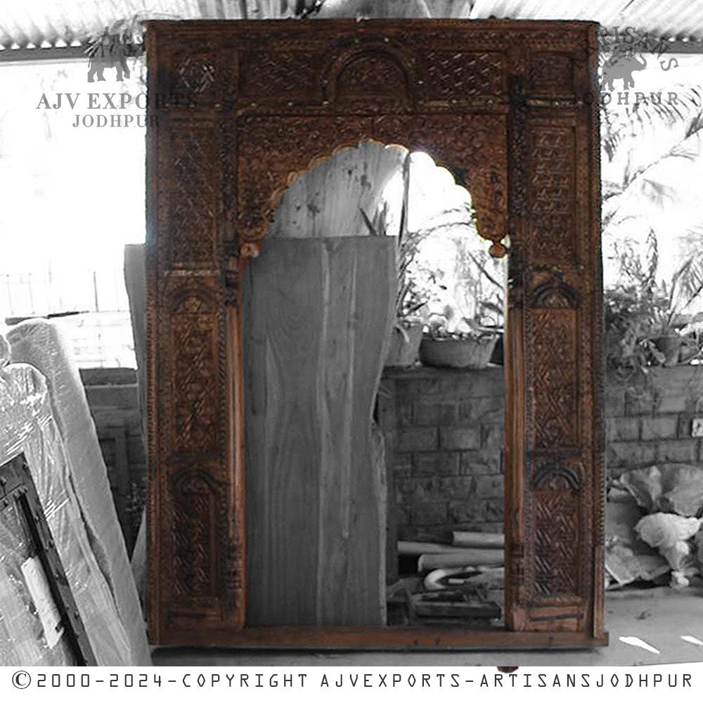 Ornate carved wooden archway with detailed design