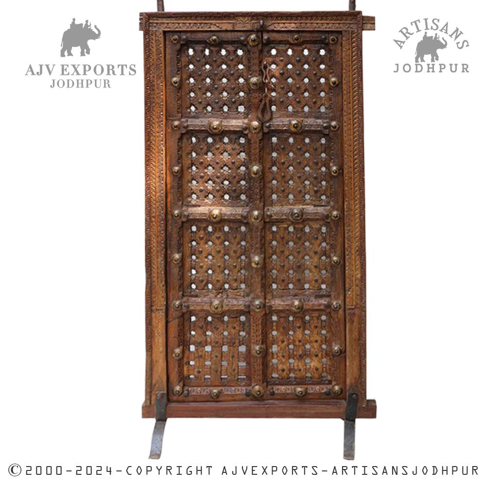 Intricately carved wooden door with lattice design