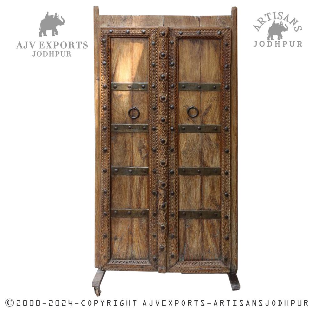 Wooden door with metal straps and rings