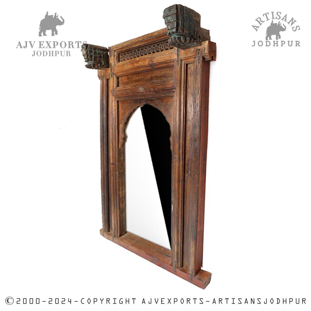 Traditional wooden arch frame with intricately carved pillar supports