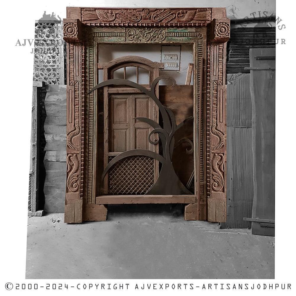 Elaborately carved wooden door frame with floral and geometric designs