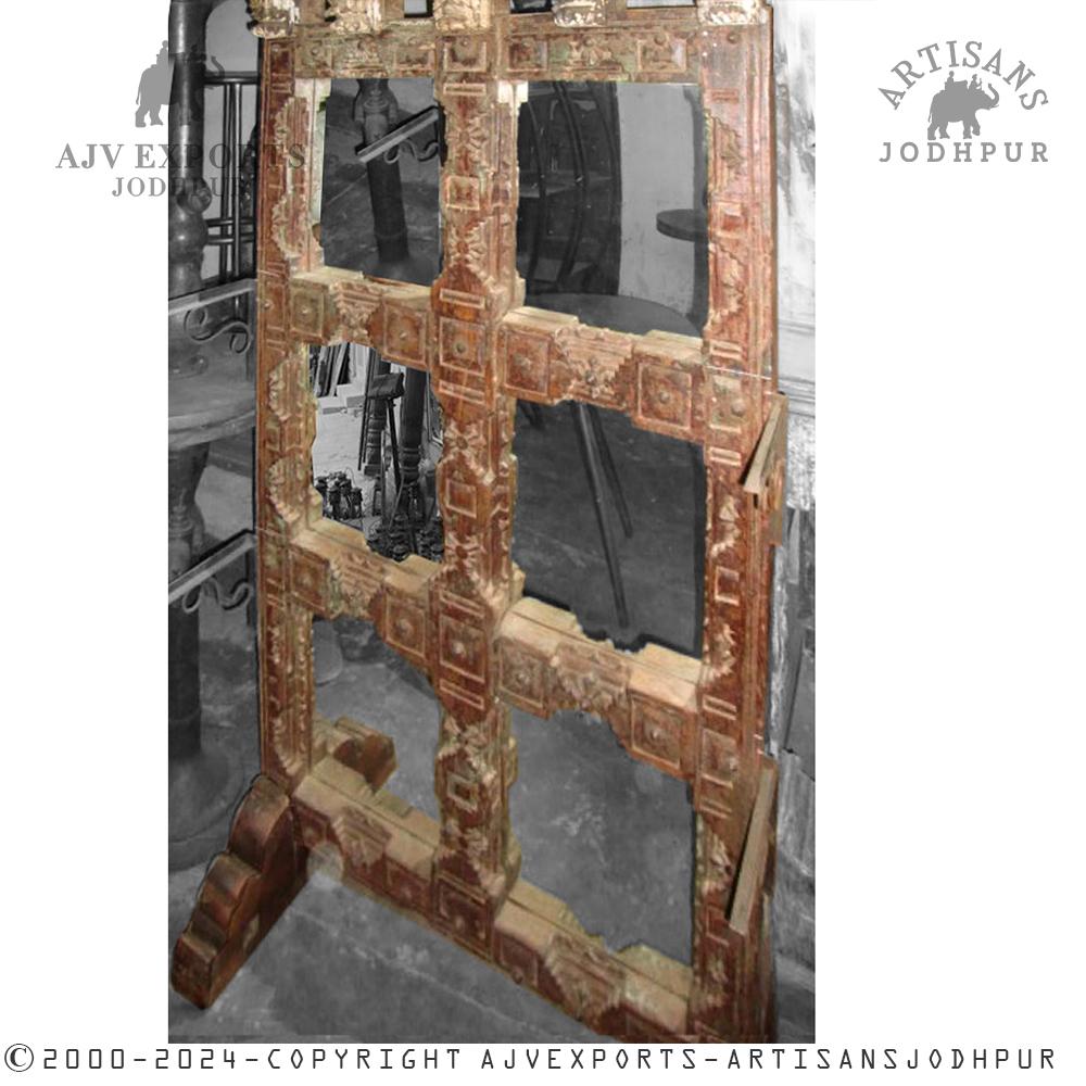 Traditional Indian wooden door with brass accents and intricate carvings