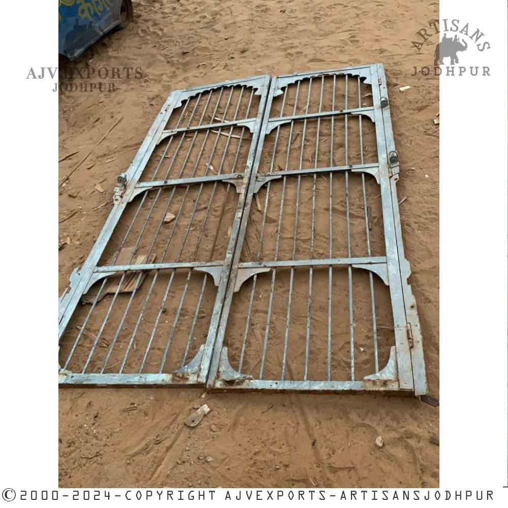 An ornate iron gate with intricate bars symbolizing the grandeur of traditional Indian architecture.